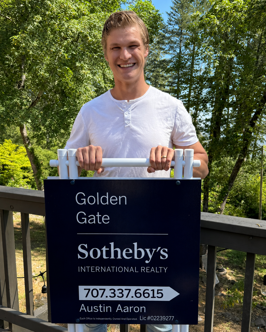 Austin Aaron with his Golden Gate Sotheby's International Realty sign in Napa Valley